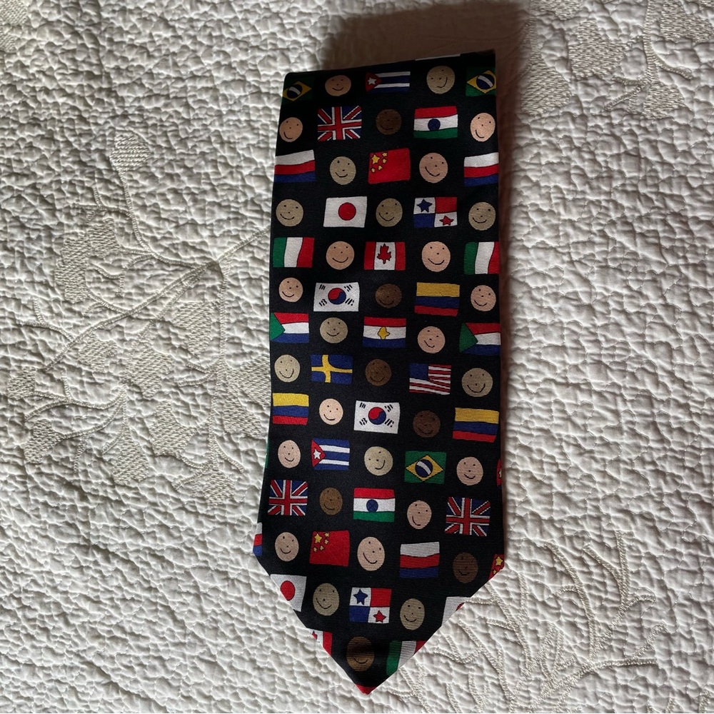 A Save the Children Collection silk necktie in a flag and smiley face pattern